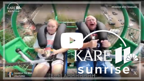 Video still of Tim Walz and his daughter on a carnival ride